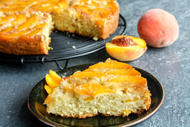 Moist and buttery cake with caramelised peaches on top