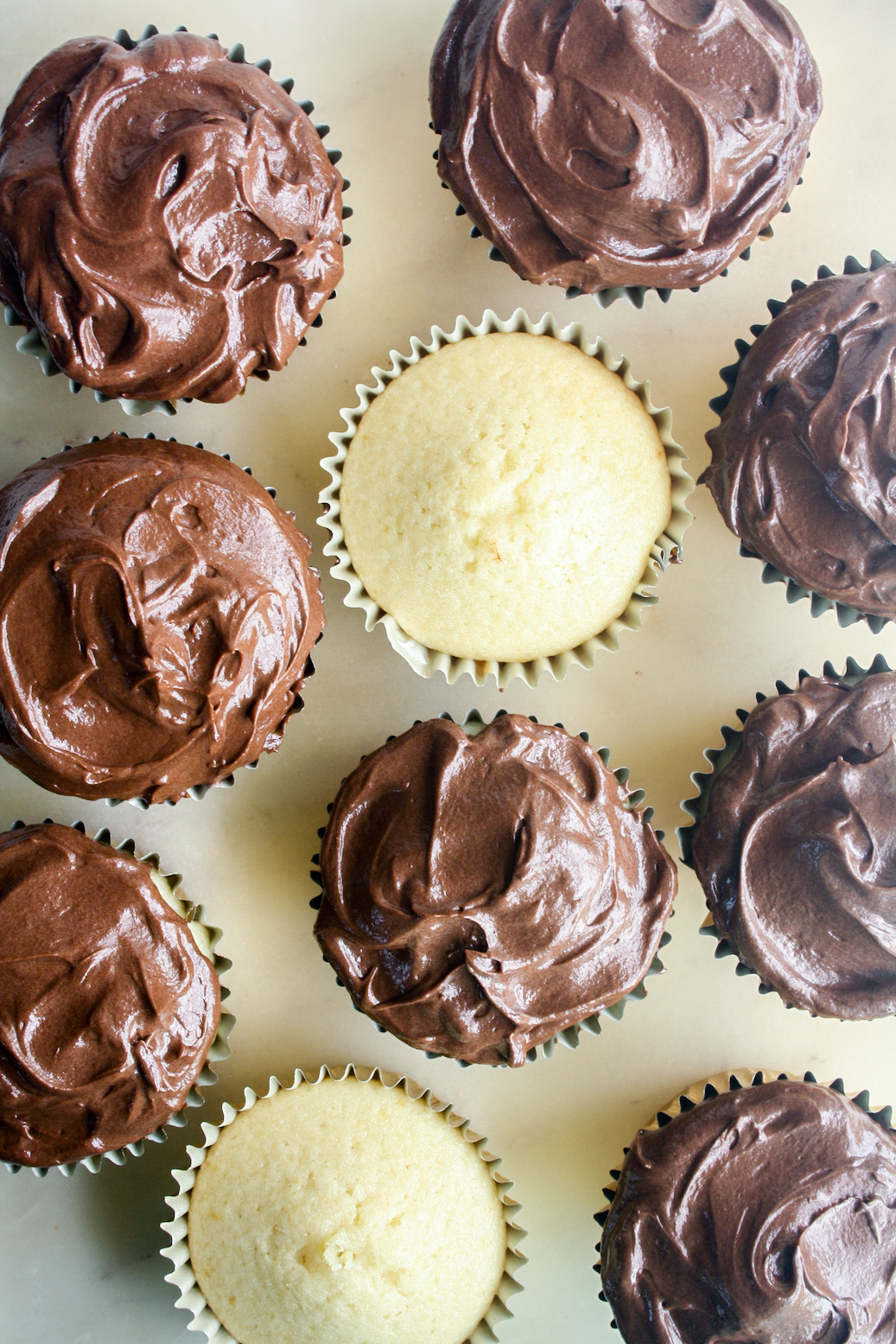 Perfect moist yellow cake cupcakes with a silky chocolate frosting