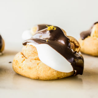 Chocolate orange creams puffs with homemade choux pastry