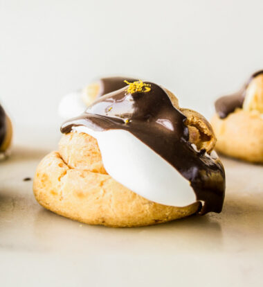 Chocolate orange creams puffs with homemade choux pastry