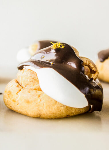 Chocolate orange creams puffs with homemade choux pastry