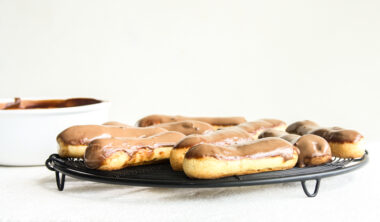 Eclairs with homemade choux pastry, filled with whipped cream and topped with chocolate ganache
