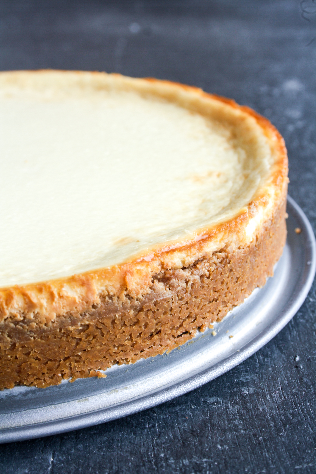 Classic, creamy, tangy New York baked cheesecake with a buttery biscuit base