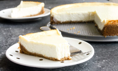 Classic, creamy, tangy New York baked cheesecake with a buttery biscuit base