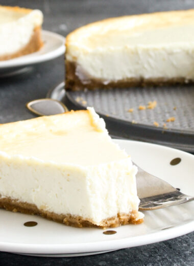 Classic, creamy, tangy New York baked cheesecake with a buttery biscuit base