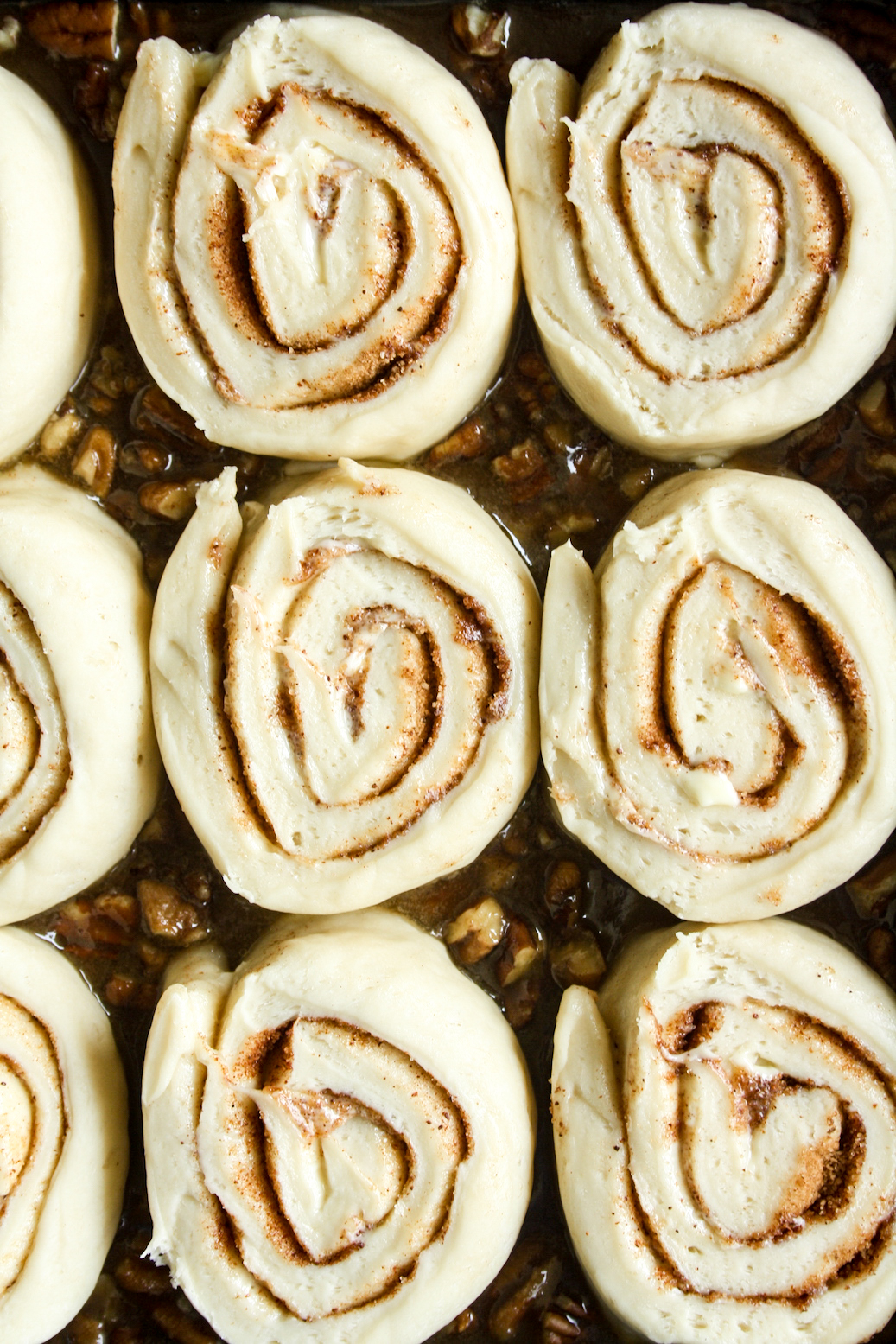 Gooey and sticky cinnamon rolls with a pecan caramel topping