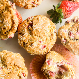 Soft, crispy-topped muffins with fresh strawberry pieces