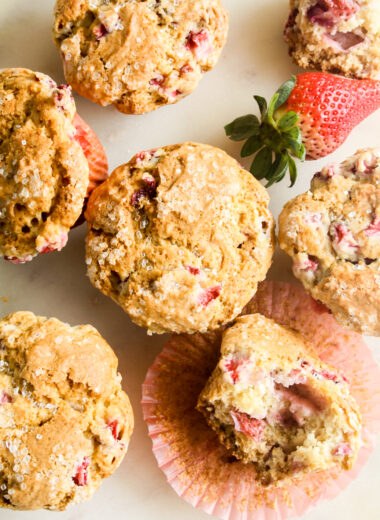 Soft, crispy-topped muffins with fresh strawberry pieces