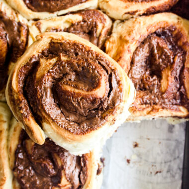 Soft and fluffy eggless bread rolls filled with gooey Nutella