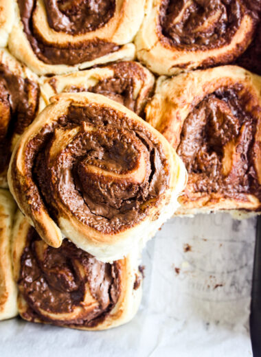 Soft and fluffy eggless bread rolls filled with gooey Nutella