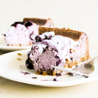 Creamy baked cheesecake with homemade blueberry compote