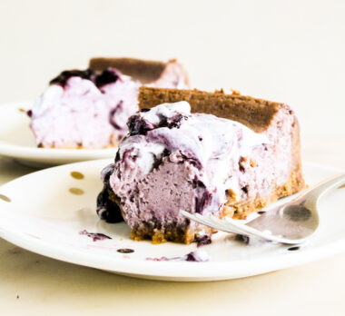 Creamy baked cheesecake with homemade blueberry compote