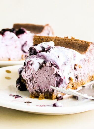 Creamy baked cheesecake with homemade blueberry compote