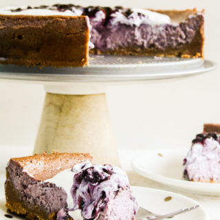 Creamy baked cheesecake with homemade blueberry compote
