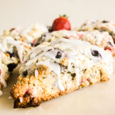 Tender, crumbly berry scones with a tangy lemon glaze