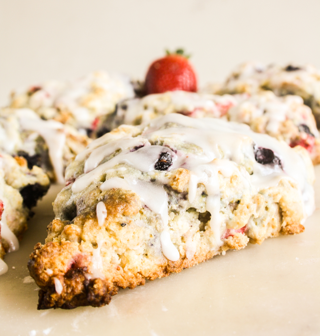 Tender, crumbly berry scones with a tangy lemon glaze
