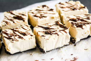 Light and creamy no bake peanut butter cheesecake bars with Oreo Crust