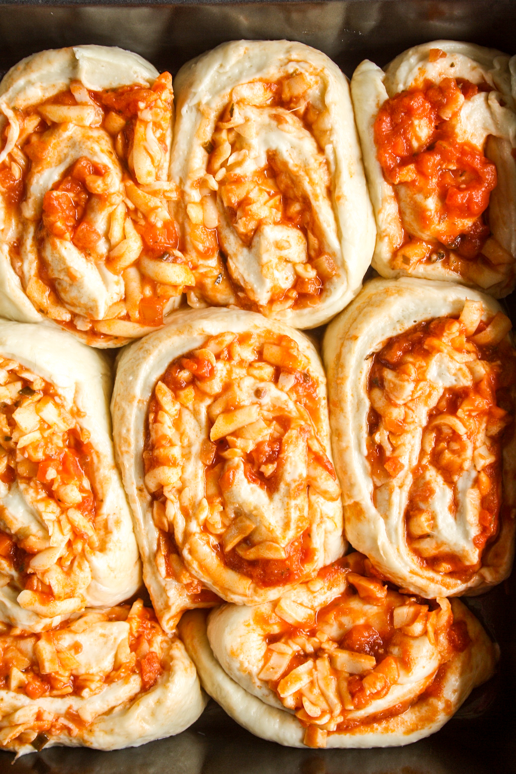 Soft, cheesy bread rolls with pizza sauce and mozzarella