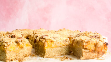 Buttery, soft shortbread bars with peach filling and crumble topping