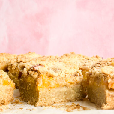 Buttery, soft shortbread bars with peach filling and crumble topping