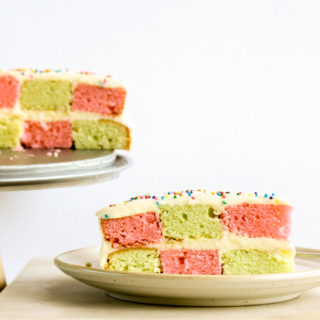 Classic vanilla butter cake in a two-coloured checkerboard pattern with tangy cream cheese frosting!