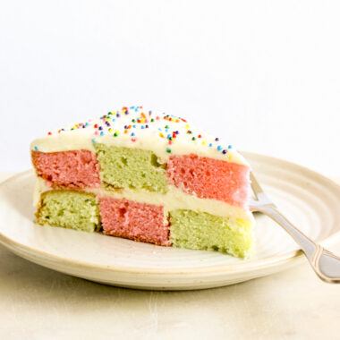 Classic vanilla butter cake in a two-coloured checkerboard pattern with tangy cream cheese frosting!