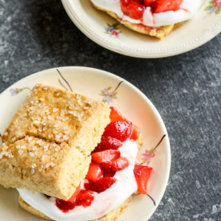 Tender, buttery sour cream biscuits sandwiched with fresh strawberries and sweetened whipped cream