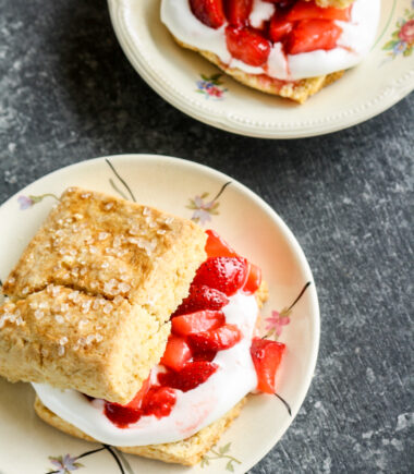 Tender, buttery sour cream biscuits sandwiched with fresh strawberries and sweetened whipped cream