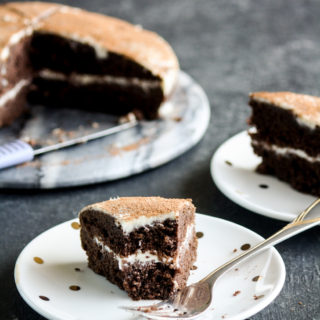 A soft and fluffy chocolate sour cream sponge cake with sour cream frosting