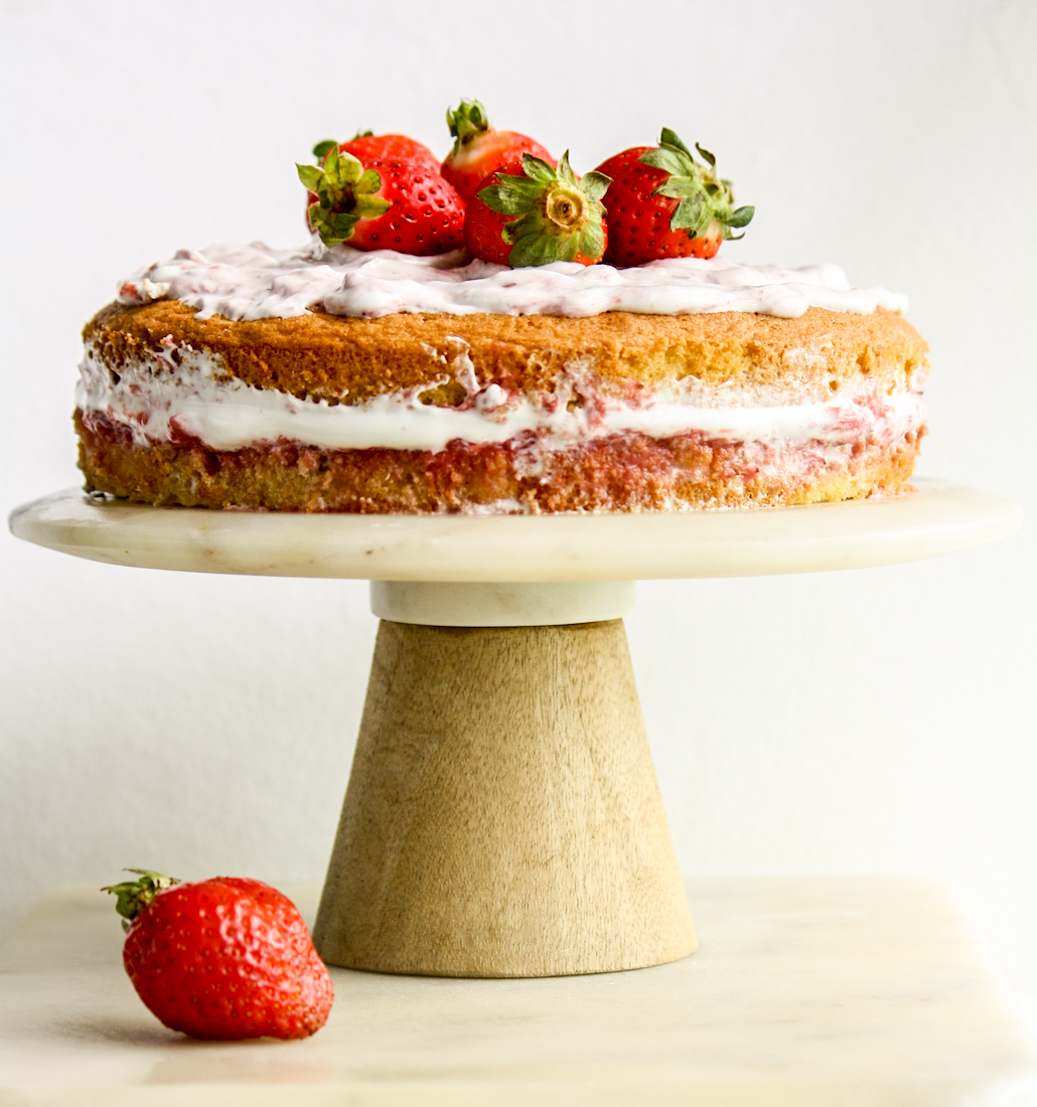 Light and fluffy Genoise sponge with homemade strawberry compote, whipped cream and fresh berries