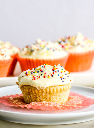 Soft and fluffy eggless vanilla cupcakes with tangy cream cheese frosting