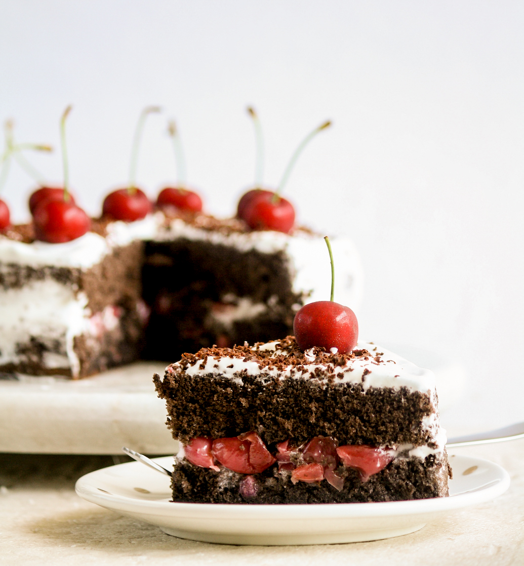 Light chocolate Genoise sponge layered with boozy cherries and whipped cream