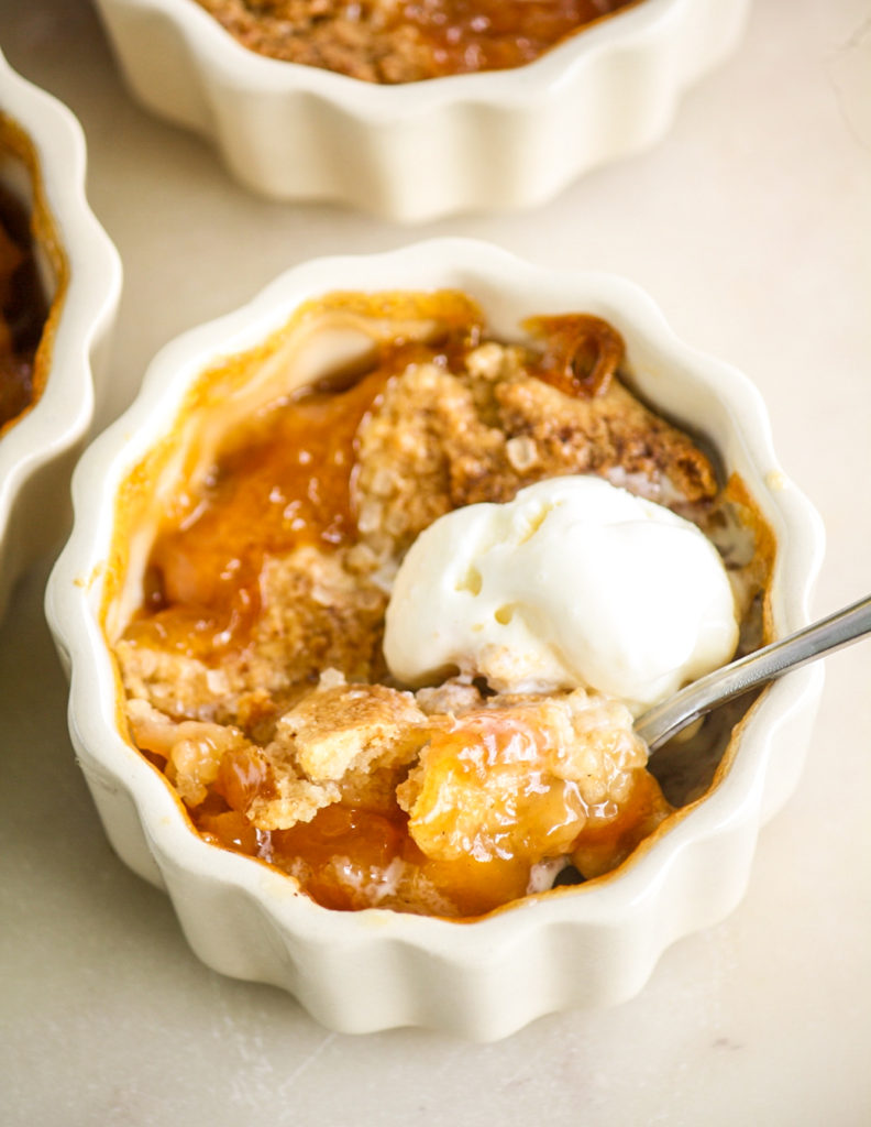 Individual cobblers with jammy peaches and a tender biscuity topping