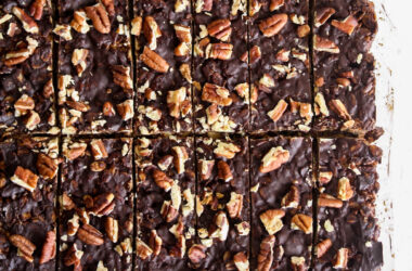 Crunchy, healthy granola bars with cocoa and toasted pecans, topped with a layer of melted dark chocolate