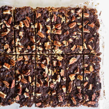 Crunchy, healthy granola bars with cocoa and toasted pecans, topped with a layer of melted dark chocolate