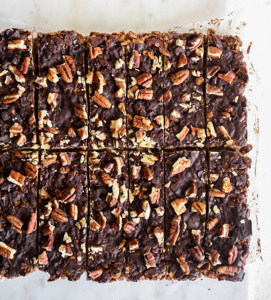 Crunchy, healthy granola bars with cocoa and toasted pecans, topped with a layer of melted dark chocolate