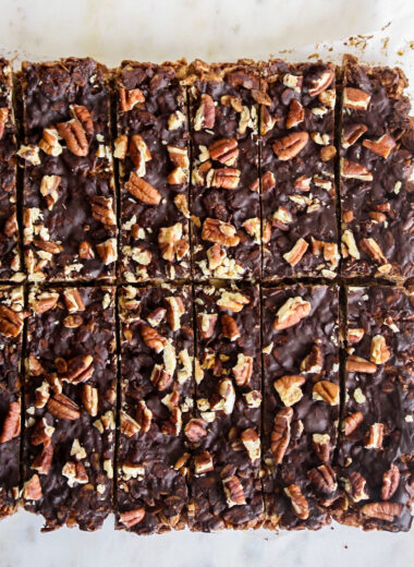 Crunchy, healthy granola bars with cocoa and toasted pecans, topped with a layer of melted dark chocolate