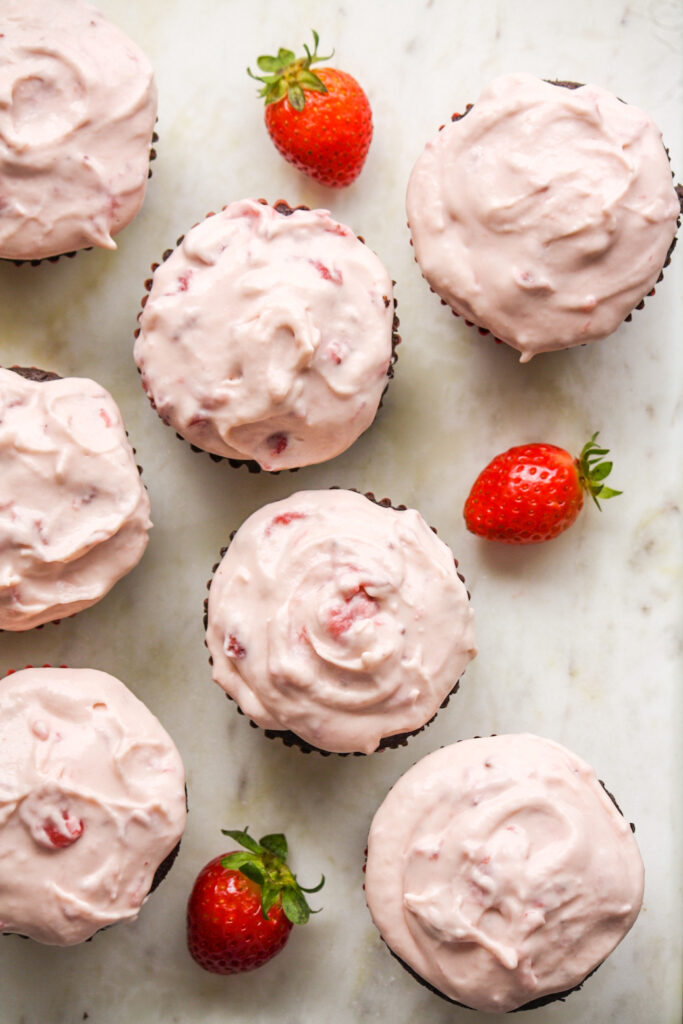 Soft, dark chocolate cupcakes topped with strawberry compote and cream cheese frosting