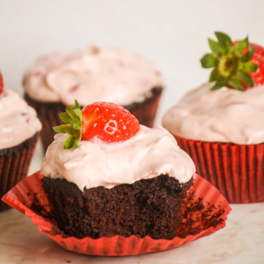 Soft, dark chocolate cupcakes topped with strawberry compote and cream cheese frosting