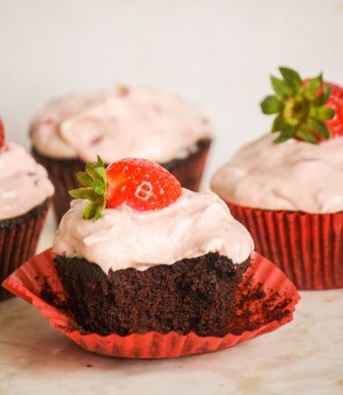 Soft, dark chocolate cupcakes topped with strawberry compote and cream cheese frosting