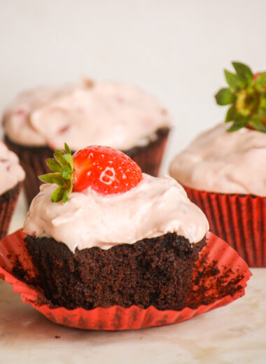 Soft, dark chocolate cupcakes topped with strawberry compote and cream cheese frosting