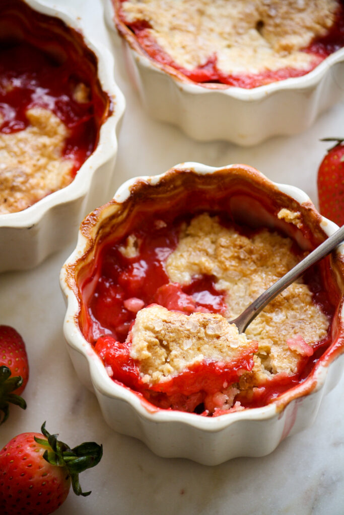 Individual cobblers with jammy strawberries and a tender biscuity topping