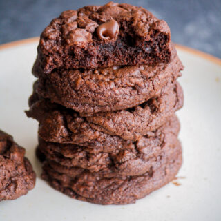 Brownie-like eggless triple chocolate cookies with melted chocolate, cocoa and chocolate chips!