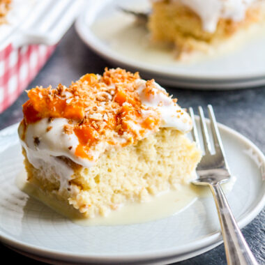 Moist tres leches cake with coconut milk and cream, topped with fresh mangoes and toasted coconut!