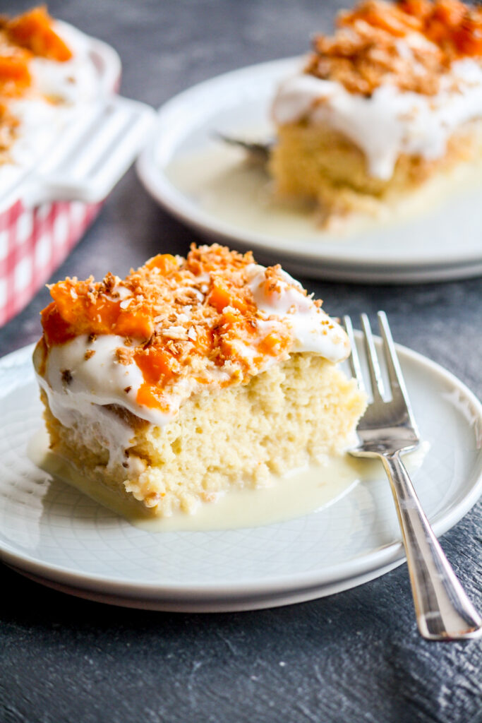 Moist tres leches cake with coconut milk, topped with fresh mangoes and toasted coconut!