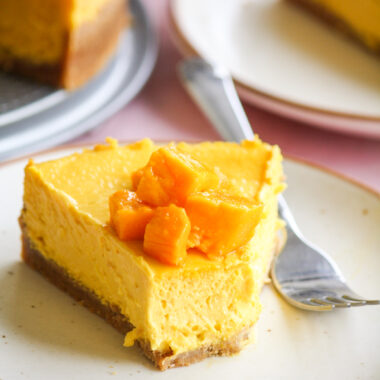 Rich, smooth, creamy baked cheesecake with fresh mango puree!