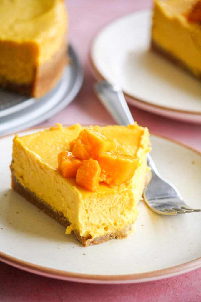Rich, smooth, creamy baked cheesecake with fresh mango puree!