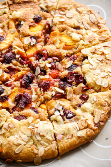 Rustic, flaky free-form pie with peaches, cherries and almond frangipane filling