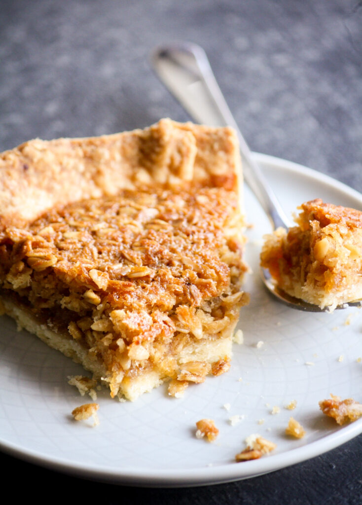 Chewy coconut oat and honey filling in homemade all-butter pie crust
