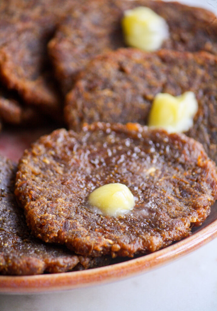 Traditional Maharashtrian sweet made from pumpkin and jaggery dough, deep-fried like puris